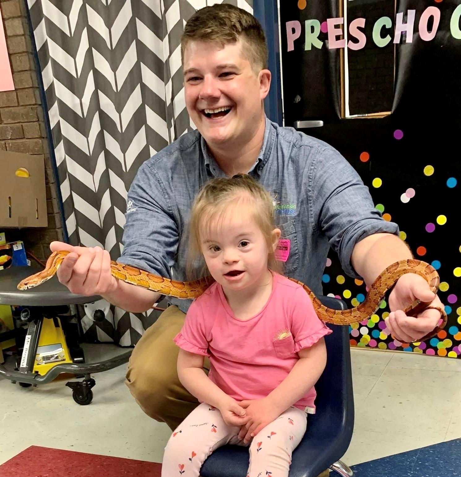 person holding snake