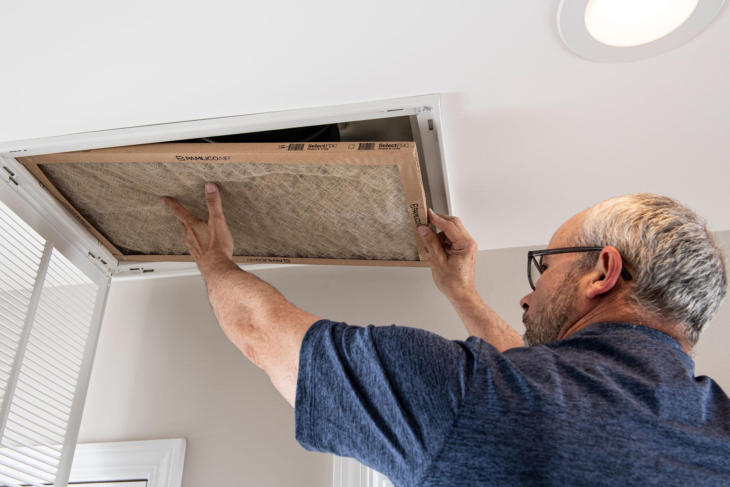 person changing filter