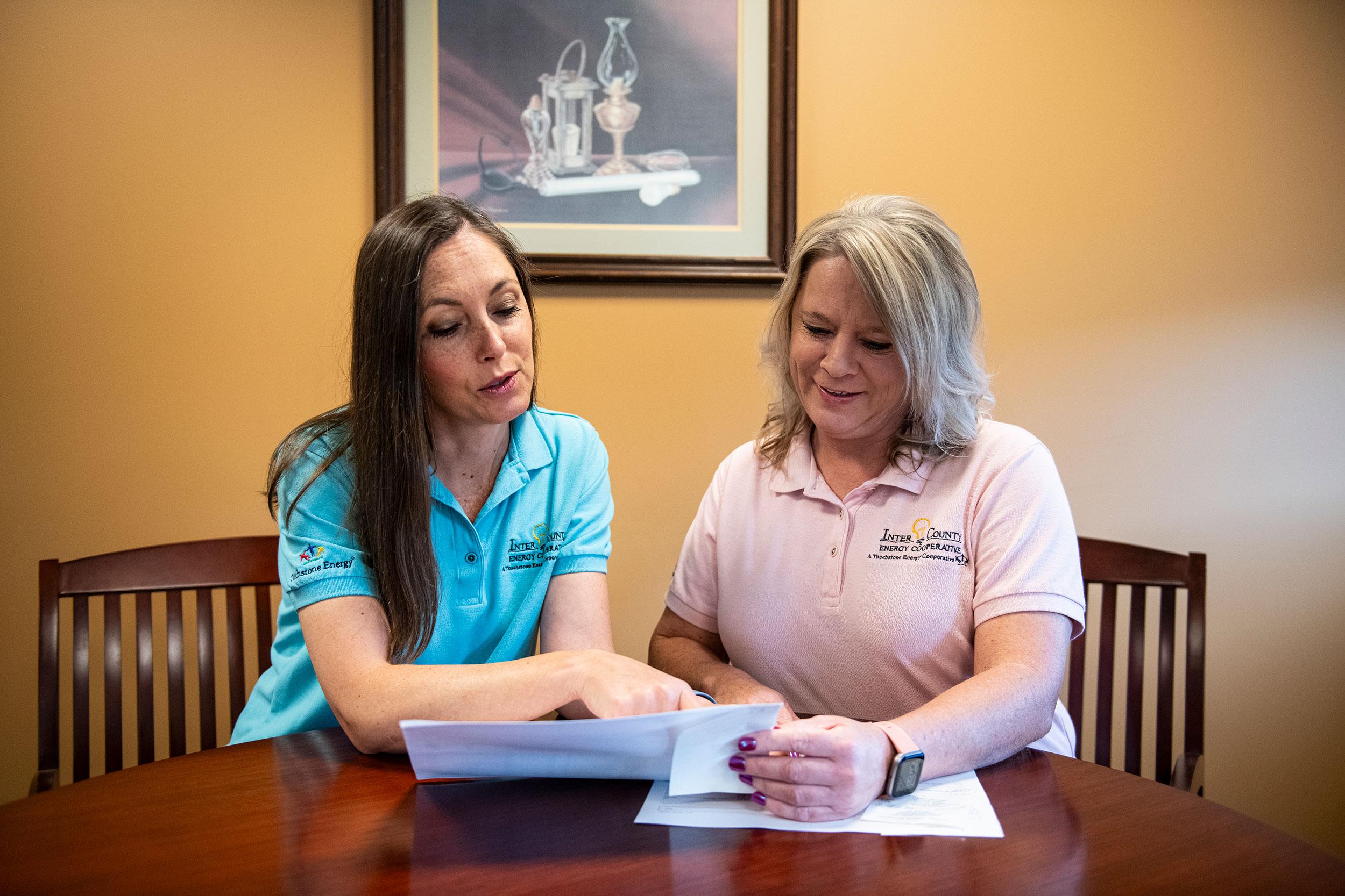 two people looking at brochure